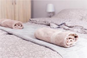 Posteľ alebo postele v izbe v ubytovaní Aurora Apartments