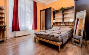 Posteľ alebo postele v izbe v ubytovaní Aurora Apartments