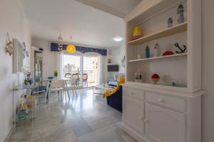 a kitchen and living room with a dining room at Carihuela beach in Torremolinos