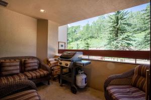 a waiting room with two chairs and a large window at Strawberry Park Ski-in Ski-Out Condo Close to Chairlift in Beaver Creek