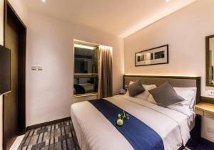 Uma cama ou camas num quarto em Hotel One Eighteen