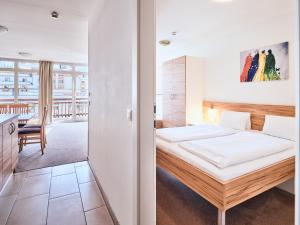 Postel nebo postele na pokoji v ubytování Grafenberg Resort by Alpeffect Hotels + 37 fotografií