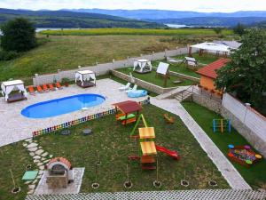 a backyard with a swimming pool and a playground at Guest House Arima in Sushina