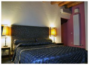 Säng eller sängar i ett rum på Casa Magnani