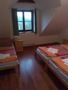 Postel nebo postele na pokoji v ubytování Penzion Pod Vyhlídkou + 36 fotografií