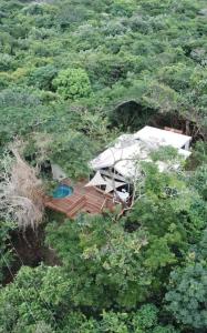 an aerial view of a house in the middle of a forest at Tinswari Self-catering Chalet in Hluhluwe