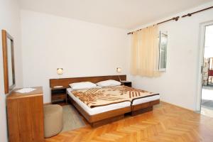 Postel nebo postele na pokoji v ubytování Apartment Novi Vinodolski 5587c