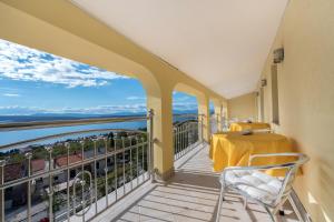 a balcony with a view of the ocean at Apartments with a parking space Dramalj, Crikvenica - 5592 in Dramalj