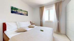 Ένα ή περισσότερα κρεβάτια σε δωμάτιο στο Zen-Pok House on the Beach - Pokrivenik