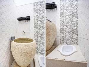 OYO 91403 Reva Residence Syariah tesisinde bir banyo