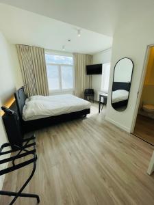 Postel nebo postele na pokoji v ubytování Hotel Bell-X Kortrijk-Wevelgem