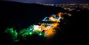 a view of a city at night with lights at Öztürk Farm House in Samsun