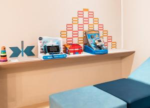 a shelf with toys on it in a room at ibis Styles Toulon Centre Port in Toulon