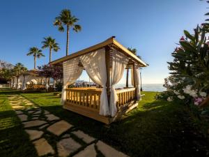 a gazebo on the lawn at a resort at AQI Hydros Club in Kemer