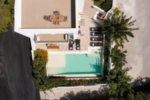 an aerial view of a house with a swimming pool at Thalassa Luxury Villa in Ialysos