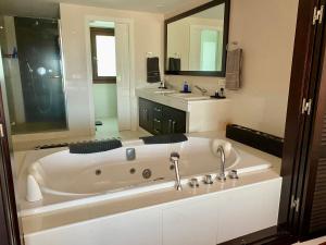 a large white bath tub in a bathroom at Luxury Villa with Pool in Marbella