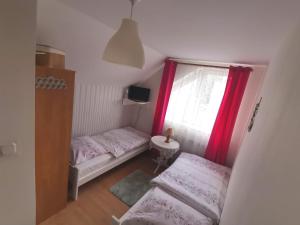 Postel nebo postele na pokoji v ubytování Pokoje gościnne u Aleksandry