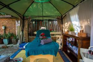 a room with a bed in a gazebo at Doringpoort Lodge in Marloth Park