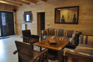 a living room with a couch and a table at Chalet de Charme, Cedar, Lebanon, ENTIRE CHALET in Al Arz