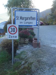 a sign for a st margariter in livan istg istg istg istg istg at Hotel Pension Schwaiger in Sankt Margarethen im Lungau