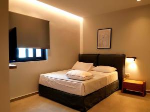 Giường trong phòng chung tại K35 Apartments