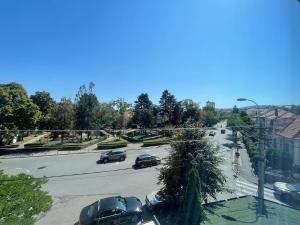 a view of a city street with cars on the road at Engels apartment in Cluj-Napoca