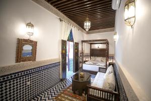 A bed or beds in a room at Dar Hafsa
