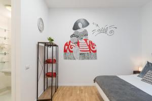 Łóżko lub łóżka w pokoju w obiekcie vip PUERTA DEL SOL, by MONARO*****
