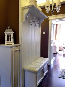 a room with a white door with a bench in it at Sweet Chocolate in Żywiec