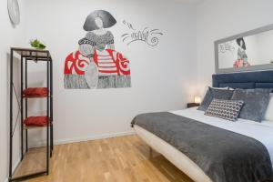 Łóżko lub łóżka w pokoju w obiekcie vip PUERTA DEL SOL, by MONARO*****