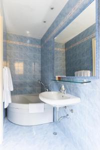 Koupelna v ubytování Hotel Garda