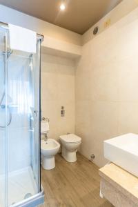Koupelna v ubytování Hotel Garda