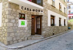 a stone building with a sign that reads casa robbia at Apartamento Casa Roda in Bielsa