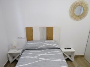 A bed or beds in a room at Apartamento Casa Roda