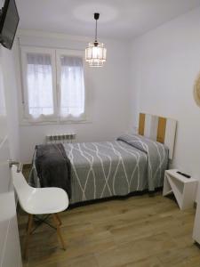 A bed or beds in a room at Apartamento Casa Roda