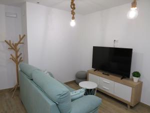 A television and/or entertainment centre at Apartamento Casa Roda