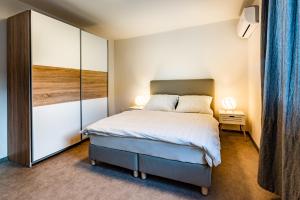 Posteľ alebo postele v izbe v ubytovaní bergRESORT apartments