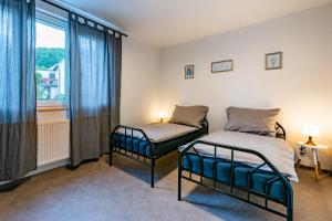 Posteľ alebo postele v izbe v ubytovaní bergRESORT apartments