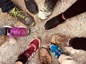 a group of people standing on the ground with their shoes at Ferienhaus Wiesenchalet im Sauerland in Schalksmühle +23 photos