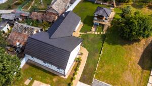 an overhead view of a house with a black roof at Zlatne perle in Vrdnik