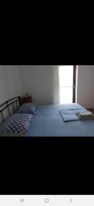 Postel nebo postele na pokoji v ubytování Basil Apartments and Rooms