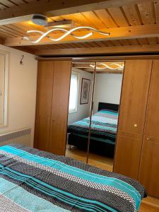 a bedroom with a bunk bed and a mirror at Majo in Koblenz