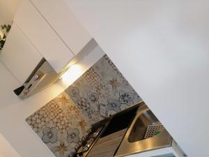 a kitchen with a stainless steel stove top oven at Historic Centre - Apartment Near Teatro Massimo in Palermo
