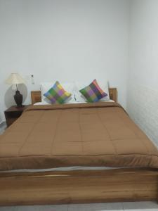 Postel nebo postele na pokoji v ubytování Pangkung Sari