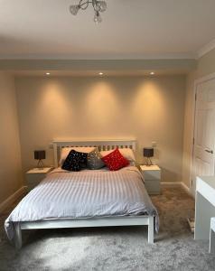 a bedroom with a bed with pillows on it at Mourne View in Killough