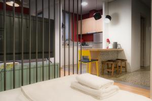 a kitchen with a table with towels on it at Athens Special in Athens