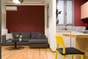 a living room with a couch and a table at Athens Special in Athens +19 photos