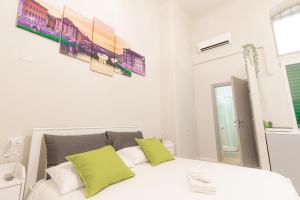 Ένα ή περισσότερα κρεβάτια σε δωμάτιο στο Signoria Guest House Florence