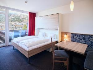 Postel nebo postele na pokoji v ubytování Hotel Planai by Alpeffect Hotels + 37 fotografií