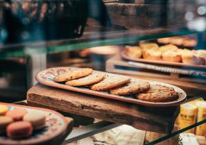 a display of cookies and pastries in a bakery at Clarion Hotel Mestari in Helsinki